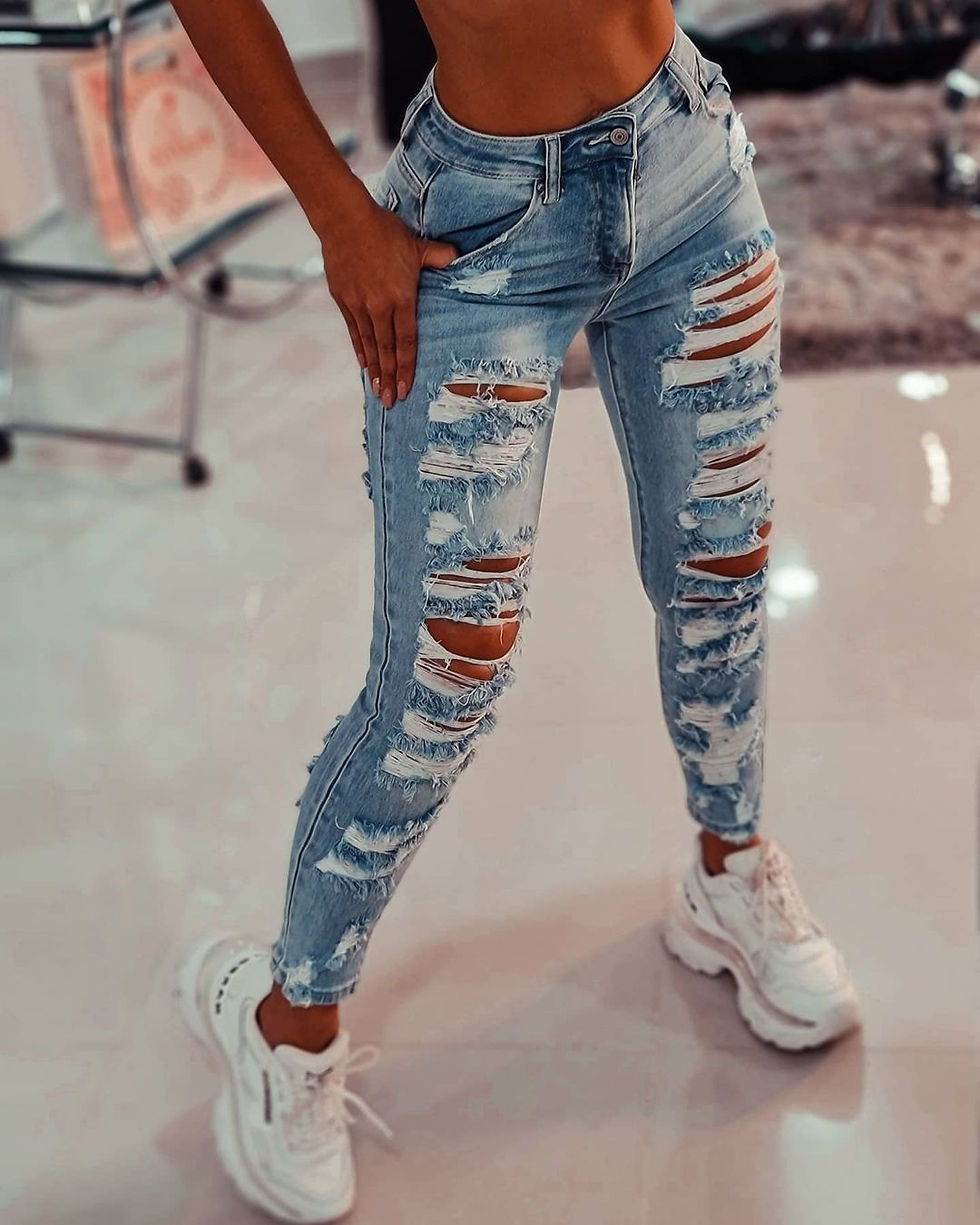 Thumbnail: Women Light Wash High Waist Skinny Jeans with Heavy Distressed Ripped Design Cas