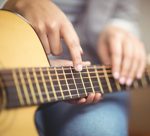 Teacher Giving Guitar Lessons