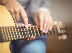 Teacher Giving Guitar Lessons