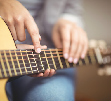 Playing Acoustic Guitar