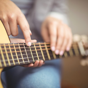 Teacher Giving Guitar Lessons