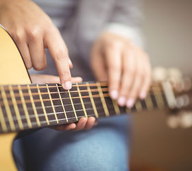 Teacher Giving Guitar Lessons