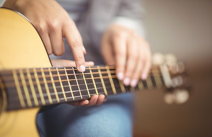 Teacher Giving Guitar Lessons