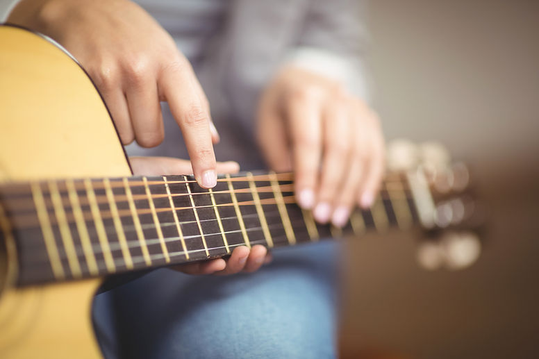 Teacher Giving Guitar Lessons
