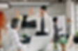 two-businessmen-congratulating-each-other-successful-job-giving-highfive-focus-is-young-bu