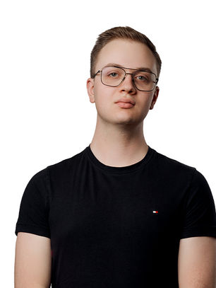 Young man in glasses, black T-shirt with small logo, stands against plain white background, looking confidently at the camera.