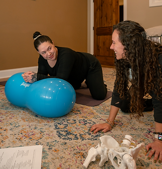 Jerika, Daisy Doula Services, teaching a birth class to a pregnant mom and her partner as 