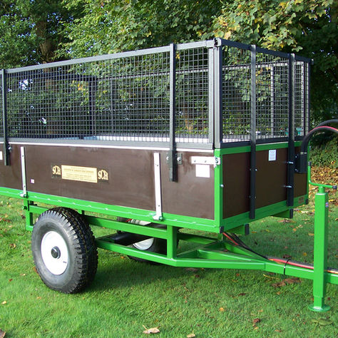 A Green Two Wheeled Trailer with Extension Sides