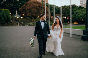Just married husband and wife walking and laughing