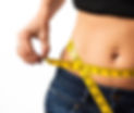 Woman measuring her waistline.jpg