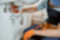male-plumber-hands-repairing-pipe-sink.jpg