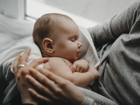 charming-newborn-boy-sleeps-mother-s-arms.jpg