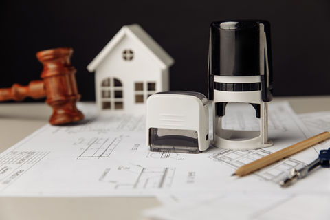 judge-wooden-gavel-stamp-model-house-with-blueprint.jpg