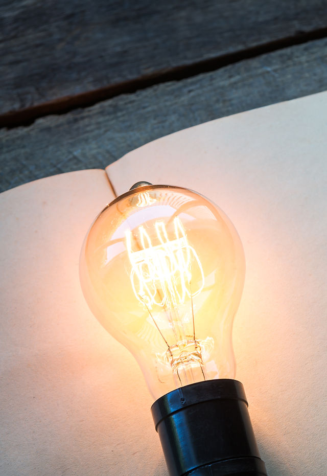 vintage-book-light-bulb-wood-table.jpg
