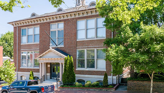 Welcome to St. Patrick’s Place Condominiums, one of Richmond’s most distinctive historic conversions, located in the heart of Church Hill. Housed in a beautifully restored 1914 schoolhouse and home to just 15 exclusive residences, this property offers a rare blend of architectural character and sophisticated city living. This elegant 1,058 sq. ft. lower-level condo features 2 bedrooms and 2 full bathrooms with a thoughtfully designed open-concept layout that seamlessly connects the living, dining, and kitchen spaces—ideal for both everyday living and entertaining. The interior showcases a modern, elevated aesthetic with polished concrete floors, plantation shutters throughout, granite countertops, a large center island, gas cooking, and a brand-new refrigerator. The spacious primary suite offers a walk-in closet and a well-appointed en-suite bath with double vanities, combining comfort and functionality. Additional highlights include a new full-size stackable washer and dryer, as well as a large, secure walk-in storage closet conveniently located just outside the unit. Residents enjoy secure building access, a beautifully landscaped shared patio and grilling area, and an individually deeded off-street parking space. Perfectly positioned for true urban living, this home is just minutes from Downtown Richmond and multiple VCU campuses, with easy access to local dining, boutique shopping, and the Virginia Capital Trail. Offering historic character, modern finishes, and an unbeatable location, this is a rare opportunity to own a stylish, low-maintenance home in one of Richmond’s most vibrant and walkable neighborhoods.