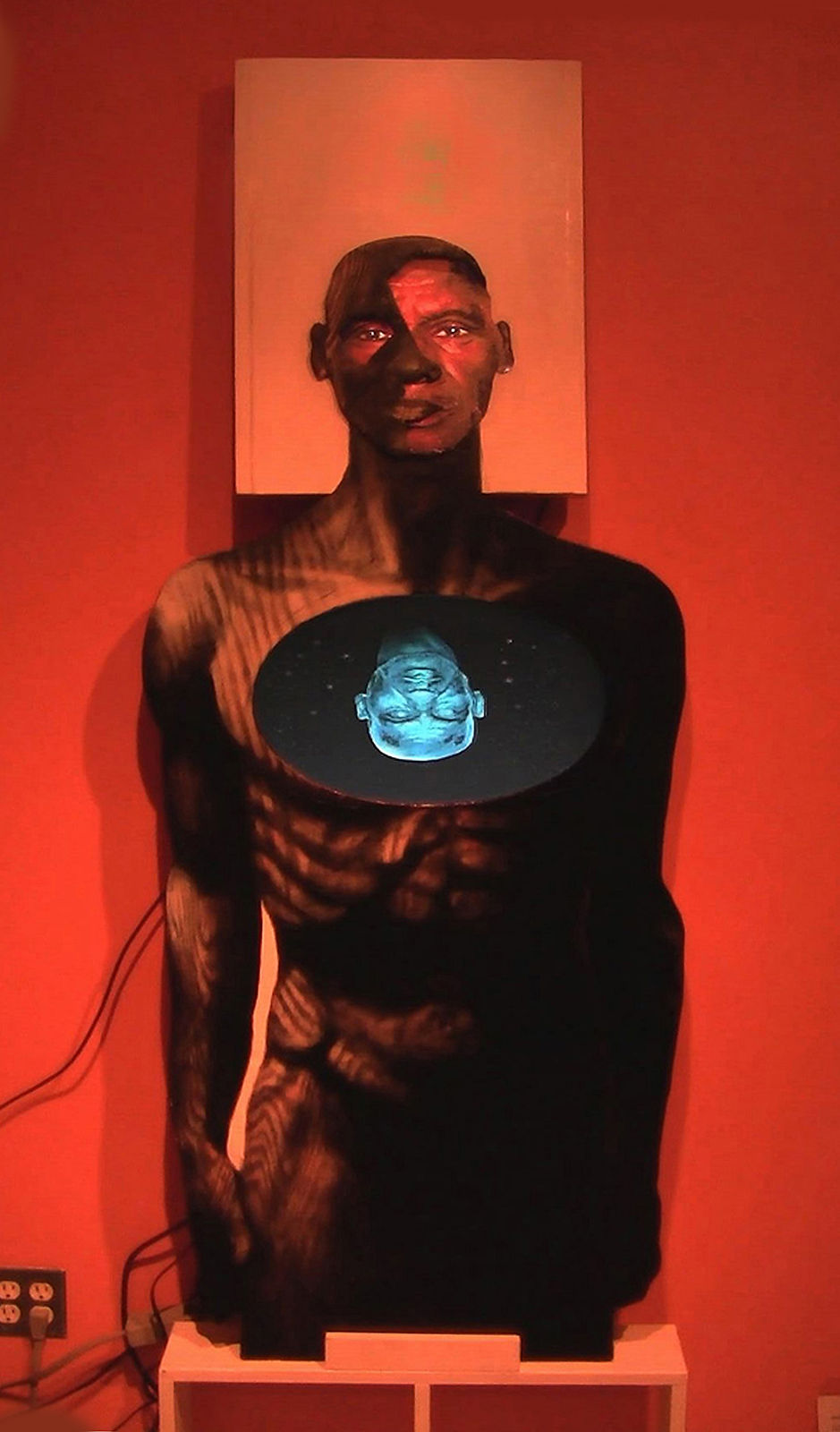 Human silhouette with intricate glowing head in chest