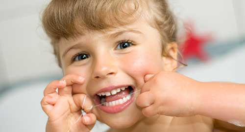 Young Girl Flossing