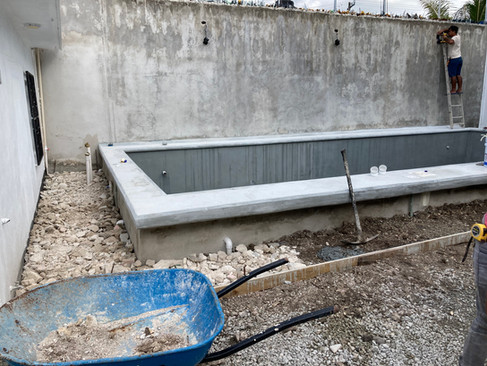 The pool deck and garden pathways are being concreted Marevilla Cozumel