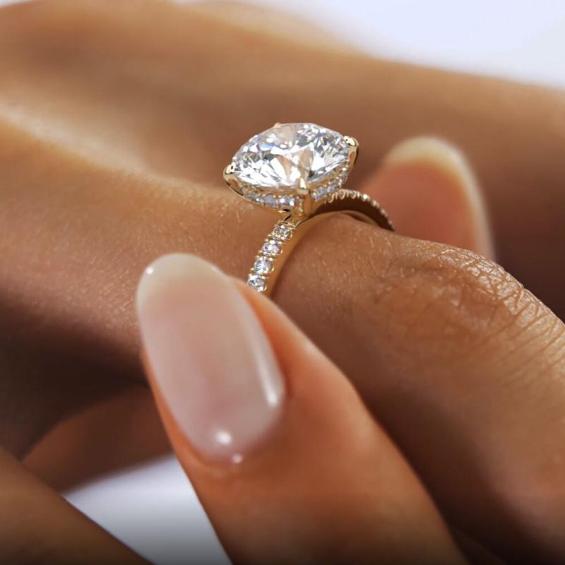 Thumbnail: The 2ct Round Cut Moissanite Ring with Half Pavé & Hidden Halo