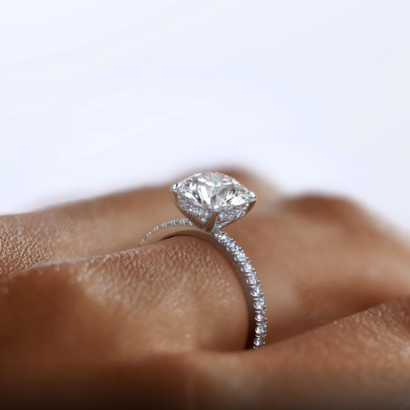 Thumbnail: The 2ct Round Cut Moissanite Ring with Half Pavé & Hidden Halo