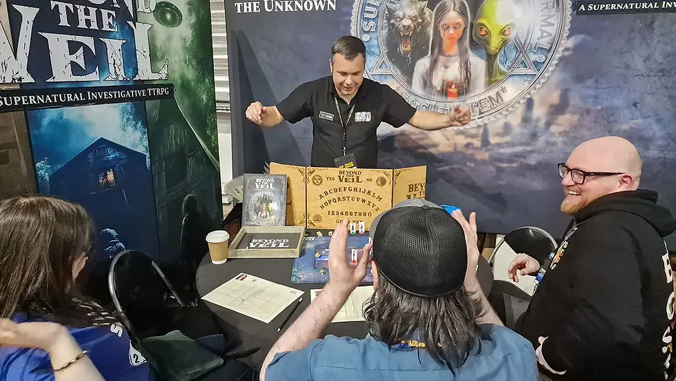 Alex, The Overseer, runs a game for some attendees who had never met but left as friends.