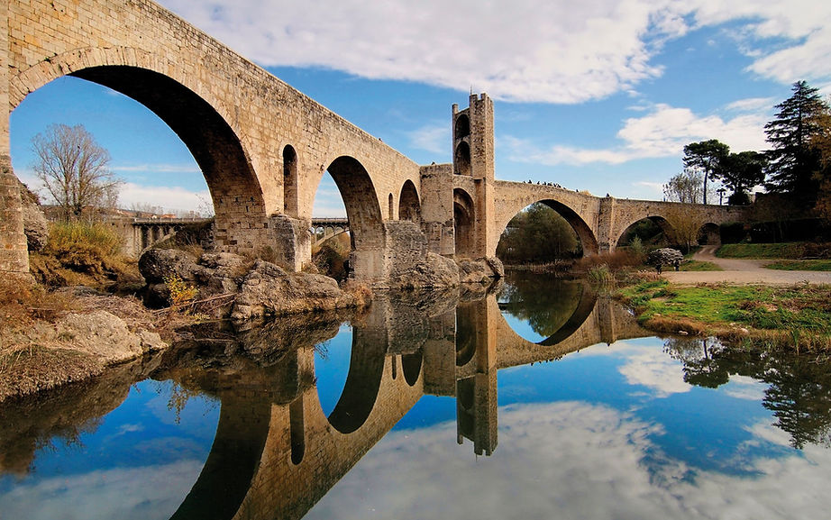 Medieval bridge of Besalú in Girona near the mountains of Ripoll, Camprodon and Vall de Núria, perfect for day trips from Costa Brava with StayBrava Caravan