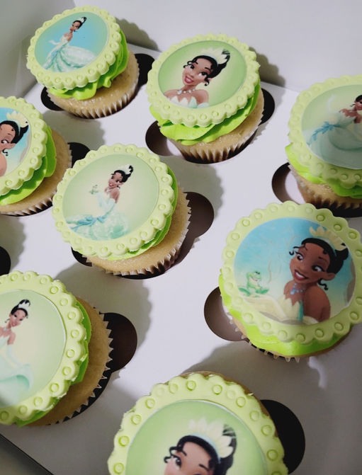 Custom cupcakes with edible images of Princess Tiana.