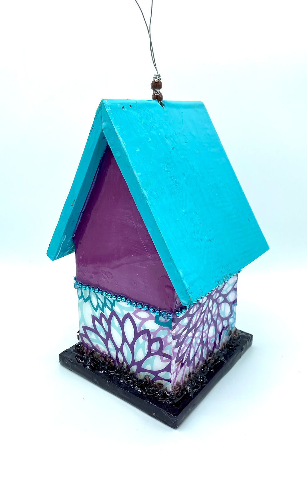 Thumbnail: Back view of a purple and teal birdhouse with a dragonfly.