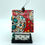 Thumbnail: Side view of mini birdhouse and a red colorful day of the dead roof.