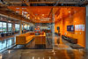 modern-office-space-with-vibrant-orange-accents-glass-walls.jpg