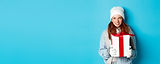 winter-holidays-christmas-sales-concept-thoughtful-redhead-woman-standing-white-beanie-gl.