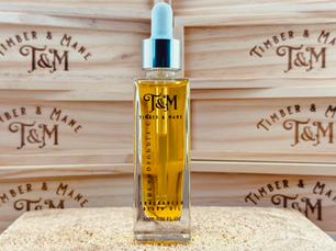 Timber & Mane beard oil bottle with cigar boxes in background