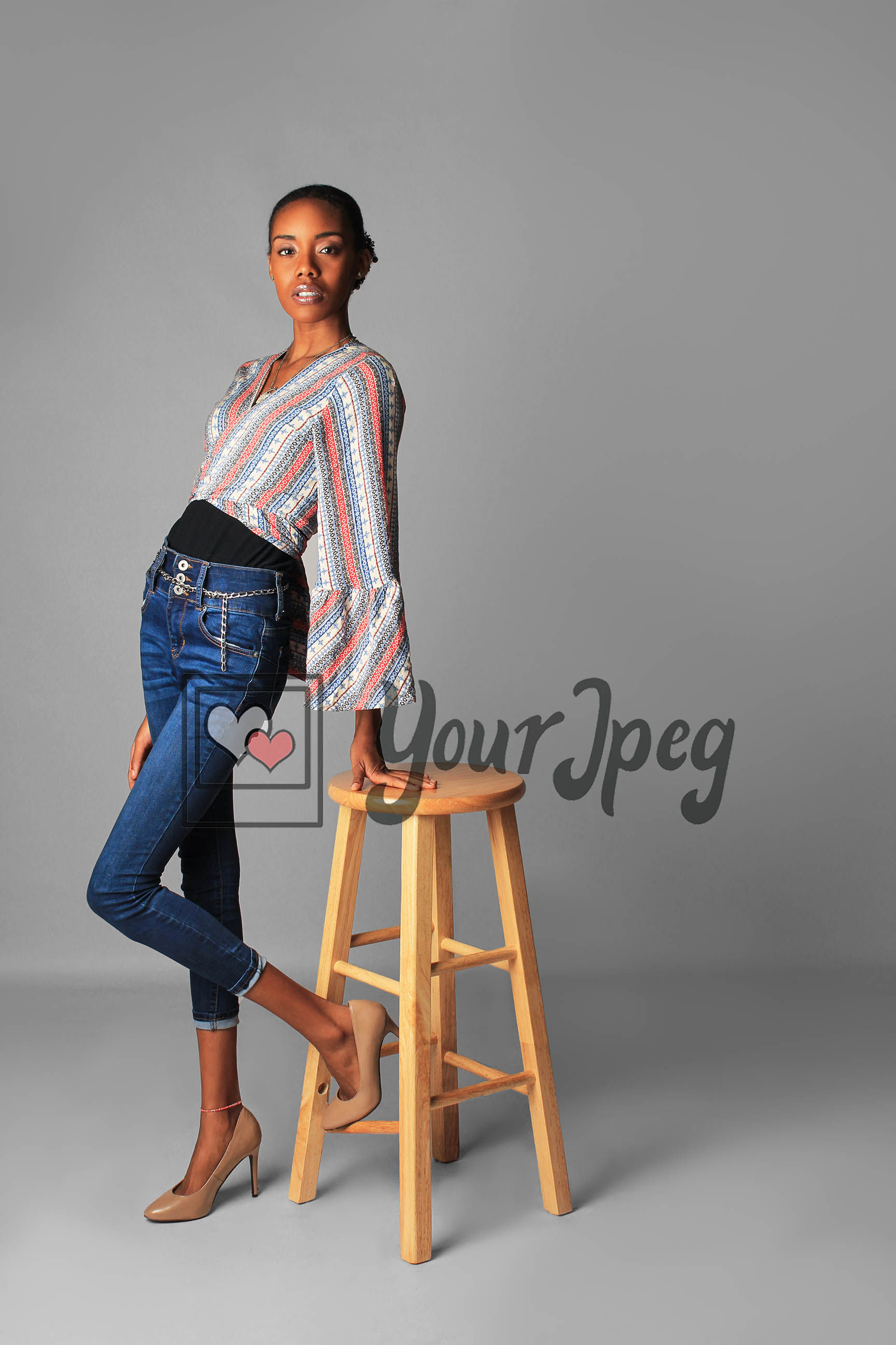 Model Leaning On Stool