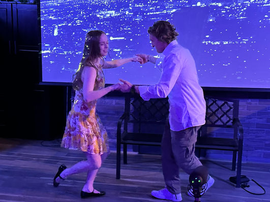 Two actors dancing and performing a La La Land scene at Babcock Studios