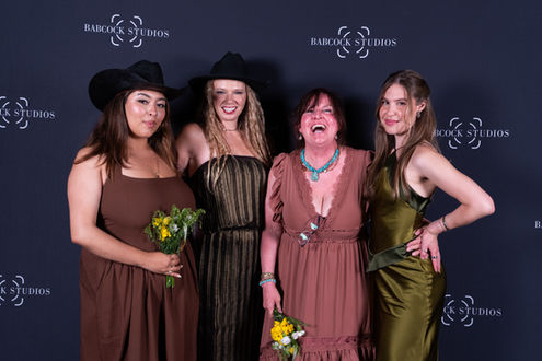 Actors posing together on the Babcock Studios Summer Film Festival red carpet.