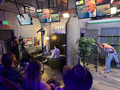 Actors and camera crew working on an on-camera scene at Babcock Studios
