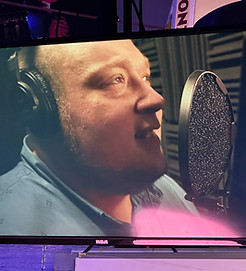Actor recording in the voiceover booth during a Voiceover Acting Intensive at Babcock Studios in Denver.
