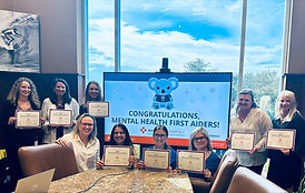Mental Health First Aid Participants Smiling with their Certificates