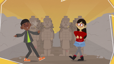 a boy and a girl are standing in front of statues