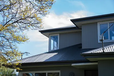 Custom residential build in Drummond by Backman Builders, showcasing modern exterior finishes and architectural window design