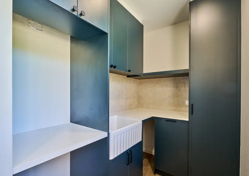Modern sink with ample overhead storage.