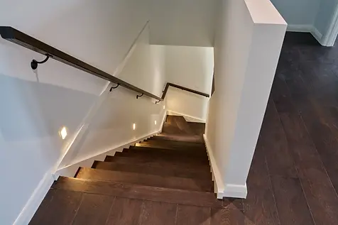 Bespoke architectural home build in Cherokee by Backman Builders, showcasing a modern timber staircase with integrated lighting.