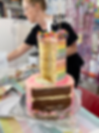 Image of a catering assistant cutting and serving birthday cake