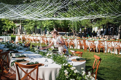 A wedding planner decorating the wedding reception venue