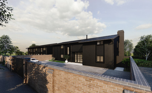 Matthew Montague Architects Front of the barn conversions with black cladding and front parking area