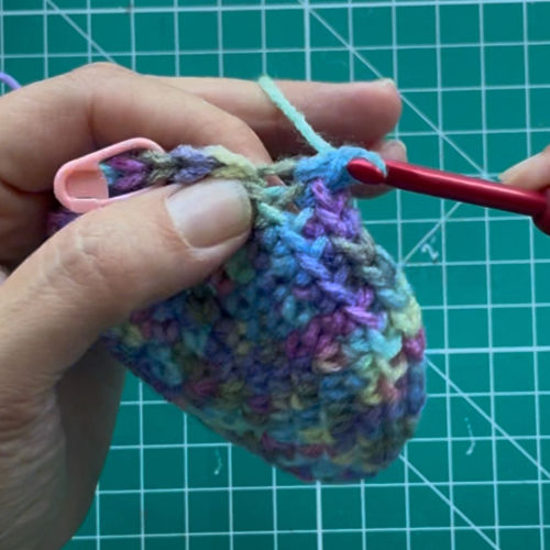 Photo 9 - By the end of this RND you will have a line of FLO stitches left over that you will later stitch into.