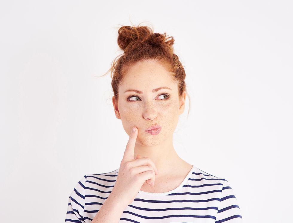 Woman with hand on chin contemplating a decision