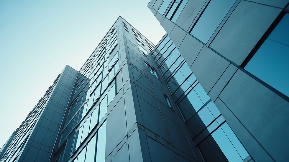 Eye-level view of a modern office building with company logo