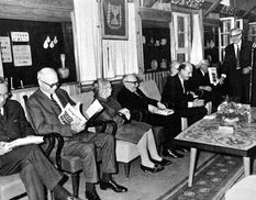 Joseph Aviram greets William F. Albright (second from left) at a ceremony held by President Zalman Shazar marking the publication of Eretz-Israel Vol. 9, dedicated to Albright