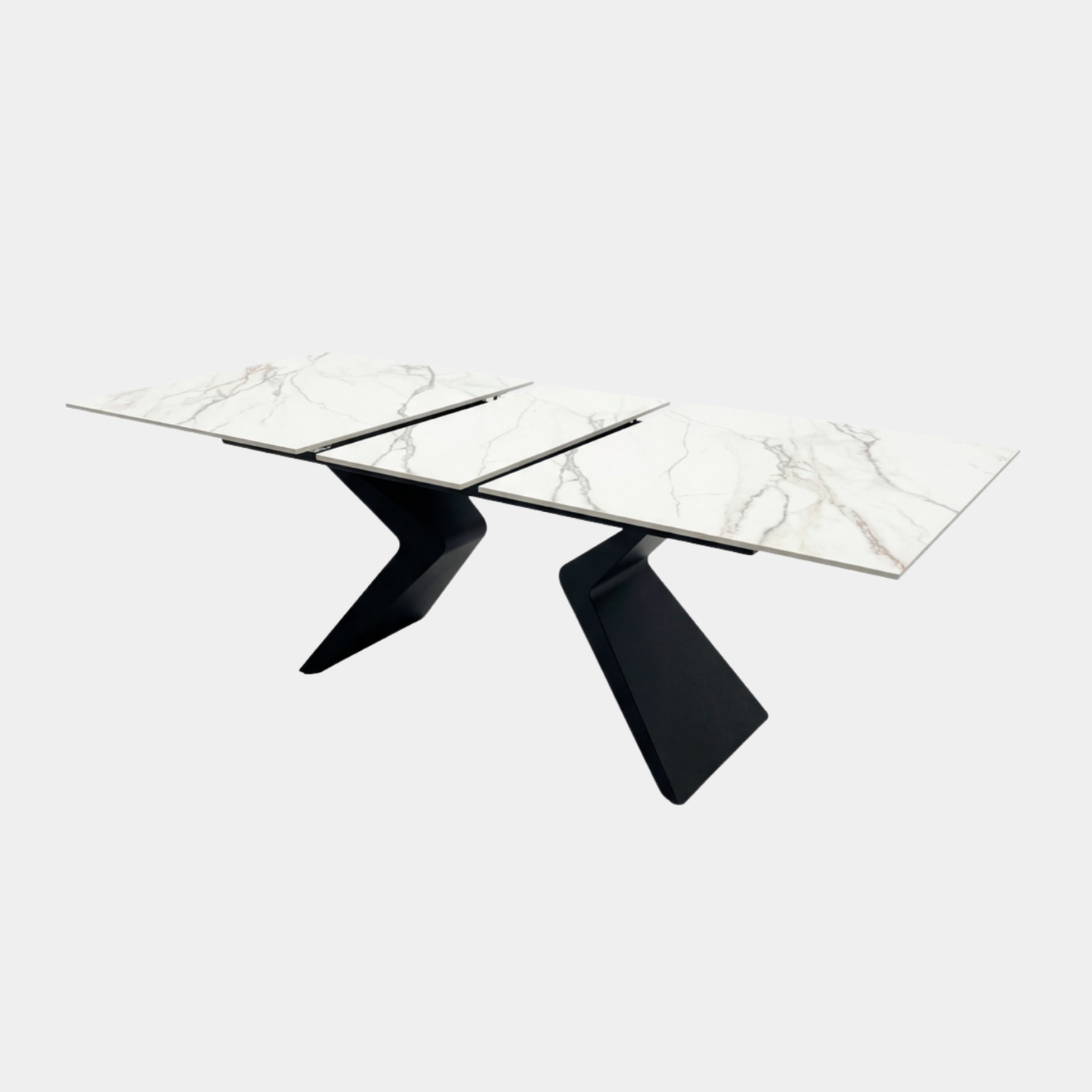 Mesa porcelánico extensible blanca con patas negras para comedor moderno.